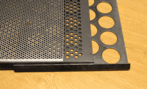 3 perforated metal sheets with different sized round holes